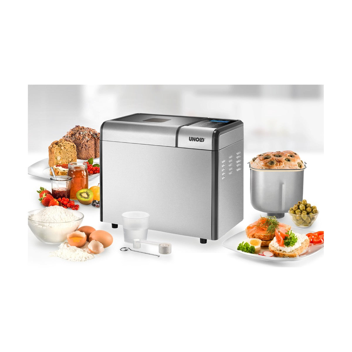 Unold broodbakmachine met zelfgebakken brood, cake en ingrediënten