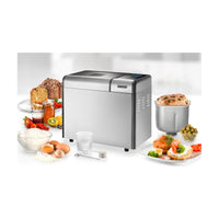 Unold broodbakmachine met zelfgebakken brood, cake en ingrediënten