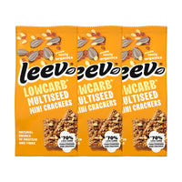 Drie zakken Leev Mini Crackers Multiseed naast elkaar, 3 x 85 gram