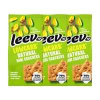 Drie zakken Leev Mini Crackers Naturel naast elkaar, 3 x 85 gram