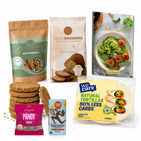 Startpakket Compleet met de Koolhydraatarme Startgids, keto granola, keto broodmix, beschuit, wraps, snoepjes kersen en een melkchocoladereep
